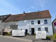 Einfamilienhaus und unbebaute Grundstücke