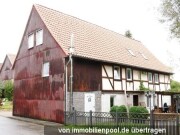 Wohnhaus, Nebengebäude und Schuppen