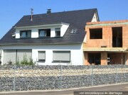 2-Familienhaus mit Einliegerwohnung und Flachdachanbau (Rohbau)