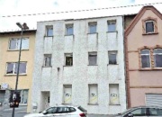Wohn- und Geschäftshaus mit Anbau