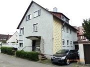 Wohnhaus mit drei abgeschlossenen Wohnungen und Garagenanbau