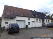 Einfamilienhaus mit Nebengebäuden sowie weiteren Grundstücken
