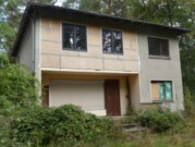 Einfamilienhaus mit Garagenanbau und Waldgrundstück